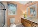 Cozy bathroom featuring a single sink vanity and shower with glass door at 5269 Blue Grass Ln, Sugar Hill, GA 30518