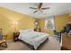 Cozy bedroom with a ceiling fan, neutral walls, and a comfortable bed at 5269 Blue Grass Ln, Sugar Hill, GA 30518