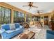 Versatile sunroom offering space for both dining and relaxing at 5269 Blue Grass Ln, Sugar Hill, GA 30518