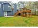 Backyard with large wood deck, stairs, and a shed at 7660 Brentwood Ct, Cumming, GA 30040