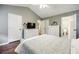 Spacious bedroom with wood floors, white furniture, and multiple closets, offering ample storage at 7660 Brentwood Ct, Cumming, GA 30040