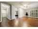 Spacious bedroom area with hardwood floors and adjacent dressing or sitting room at 7660 Brentwood Ct, Cumming, GA 30040
