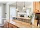 Charming kitchen featuring granite countertops, tile backsplash, and rich wood cabinets at 7660 Brentwood Ct, Cumming, GA 30040