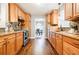 Long kitchen with stainless steel appliances and granite countertops at 7660 Brentwood Ct, Cumming, GA 30040