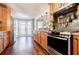 Modern kitchen with stainless steel appliances and granite countertops at 7660 Brentwood Ct, Cumming, GA 30040