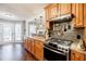 Beautiful kitchen featuring granite countertops, stainless steel appliances, and rich wood cabinets at 7660 Brentwood Ct, Cumming, GA 30040