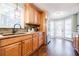 Bright kitchen featuring stainless appliances, granite counters, and a tiled backsplash at 7660 Brentwood Ct, Cumming, GA 30040