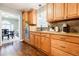Charming kitchen with granite countertops, tile backsplash, stainless steel appliances, and wood cabinets at 7660 Brentwood Ct, Cumming, GA 30040