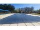 Community pool covered for the off-season, offering a safe and clean recreational space at 7660 Brentwood Ct, Cumming, GA 30040