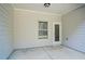 Covered back porch with access door and large window, perfect for outdoor relaxation at 234 Madison Ave, Acworth, GA 30102