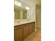 Bathroom featuring a double sink vanity with dark wood cabinets at 234 Madison Ave, Acworth, GA 30102