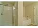Bathroom with a glass enclosed shower and soaking tub at 234 Madison Ave, Acworth, GA 30102