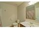 Bathroom featuring neutral tile, large mirror and vanity at 234 Madison Ave, Acworth, GA 30102