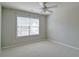 Bright bedroom with a ceiling fan and large window providing natural light at 234 Madison Ave, Acworth, GA 30102