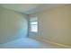 Bright bedroom with neutral carpet and paint at 234 Madison Ave, Acworth, GA 30102
