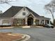 Community clubhouse with well-manicured landscape and adjacent parking at 234 Madison Ave, Acworth, GA 30102