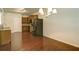 Open dining area adjacent to kitchen with hardwood floors at 234 Madison Ave, Acworth, GA 30102