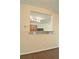 Interior view showcasing a pass-through window to the kitchen with granite countertop at 234 Madison Ave, Acworth, GA 30102