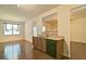 Open concept kitchen with stainless dishwasher and sink, granite countertops, and hardwood floors at 234 Madison Ave, Acworth, GA 30102