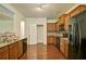 Well-lit kitchen featuring granite countertops, stainless steel appliances, and ample cabinet space at 234 Madison Ave, Acworth, GA 30102