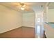 Spacious living room featuring hardwood floors and a modern ceiling fan at 234 Madison Ave, Acworth, GA 30102