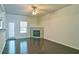 Living room featuring hardwood floors, a fireplace, and an adjacent dining area at 234 Madison Ave, Acworth, GA 30102