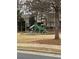 Community playground with slides, climbing features, and seating surrounded by mature trees at 234 Madison Ave, Acworth, GA 30102