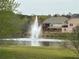 Community pond with water fountain at 234 Madison Ave, Acworth, GA 30102