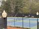 Community tennis court with benches and lighting at 234 Madison Ave, Acworth, GA 30102