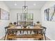 Dining room with modern lighting and seating for six at 3378 Peachtree Chase, Duluth, GA 30096