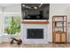 Bright living room with fireplace and mantle at 3378 Peachtree Chase, Duluth, GA 30096