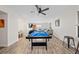 Spacious game room with pool table, seating area, and plenty of space for entertaining at 3378 Peachtree Chase, Duluth, GA 30096