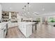 Open-concept kitchen with modern fixtures and a large island at 3378 Peachtree Chase, Duluth, GA 30096