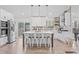 Modern kitchen with stainless steel appliances, an island with seating, and plenty of cabinet space at 3378 Peachtree Chase, Duluth, GA 30096
