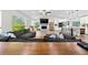 Bright living room features a fireplace, vaulted ceilings, and access to an eat-in kitchen at 3378 Peachtree Chase, Duluth, GA 30096