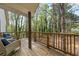 Relaxing outdoor porch area with wooded views, perfect for enjoying nature at 3378 Peachtree Chase, Duluth, GA 30096
