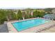 Overhead view of a sparkling pool, complete with lounge chairs and a lifeguard stand at 3800 Lake Pass Ln, Suwanee, GA 30024