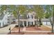 Beautiful two-story home with landscaped front yard and a detached two-car garage at 3800 Lake Pass Ln, Suwanee, GA 30024