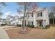 Charming two-story home featuring a welcoming front porch, landscaped yard, and classic architectural details at 3800 Lake Pass Ln, Suwanee, GA 30024