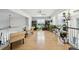 Open loft area with hardwood floors, bookshelves, plenty of natural light, and stylish decor at 3800 Lake Pass Ln, Suwanee, GA 30024