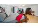 Spacious main bedroom featuring a large bed, hardwood floors, and a comfortable sitting area at 3800 Lake Pass Ln, Suwanee, GA 30024