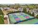 Community pickleball courts with colorful surfaces and ample lighting for evening games at 3800 Lake Pass Ln, Suwanee, GA 30024