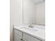 A bathroom featuring a white countertop, modern sink, and a large mirror, providing a clean and bright space at 5615 Crystal Hl, Stone Mountain, GA 30088