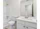 Bathroom featuring a vanity with modern fixtures, tiled floors, and a bathtub at 5615 Crystal Hl, Stone Mountain, GA 30088
