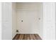 A walk-in closet with white walls, wooden floors, wire shelving, and electrical outlets for added convenience at 5615 Crystal Hl, Stone Mountain, GA 30088