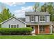 Charming two-story home featuring a well-maintained lawn and traditional architectural details at 5615 Crystal Hl, Stone Mountain, GA 30088