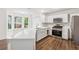 Kitchen has stainless steel appliances, including a gas range and plenty of cabinet space at 5615 Crystal Hl, Stone Mountain, GA 30088