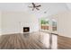 Bright living room features hardwood floors, a fireplace and great natural light at 5615 Crystal Hl, Stone Mountain, GA 30088