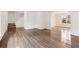 Open-concept living area with hardwood floors and staircase at 5615 Crystal Hl, Stone Mountain, GA 30088