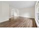 Spacious living room with hardwood floors and a view into another room through an archway at 5615 Crystal Hl, Stone Mountain, GA 30088